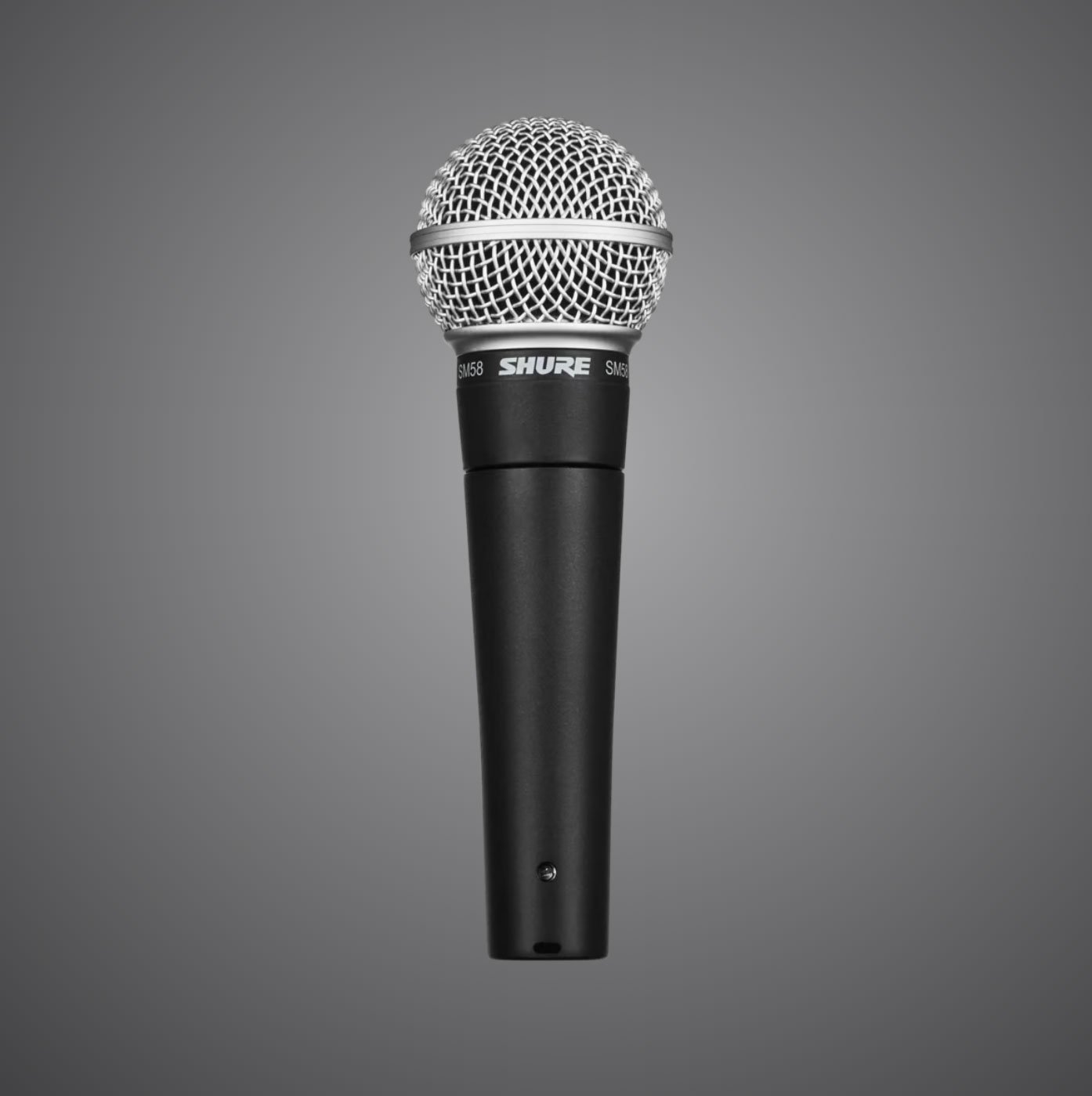 A black SM58 Dynamic Vocal Microphone with a silver mesh grille is centred on a grey gradient background.
