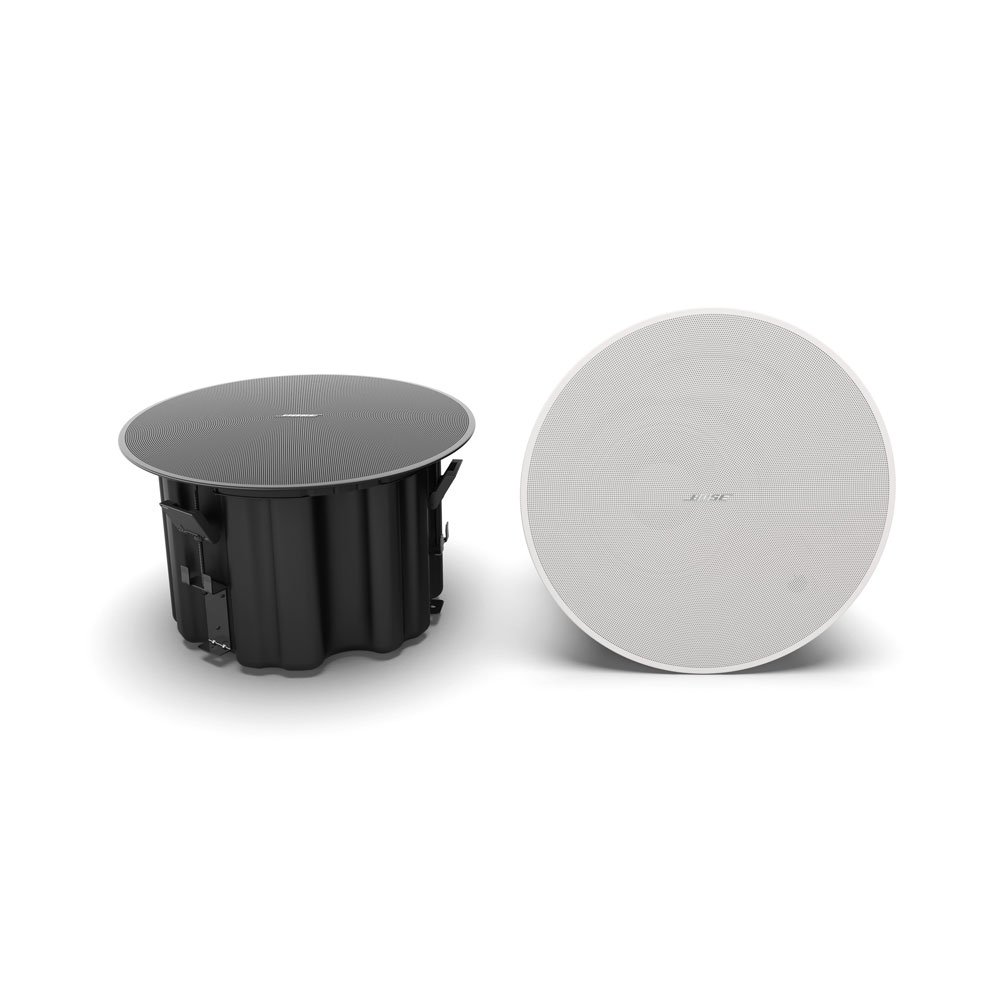 Two round DM8C Ceiling Speakers, one displaying the black back housing and the other showing the white front grille, both placed on a white background.