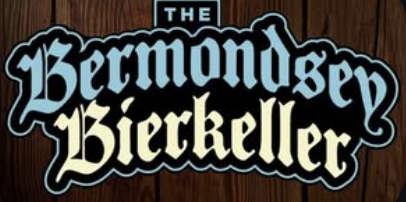 Logo reading The Bermondsey Bierkeller in blue and cream Gothic-style text on a dark wooden background, capturing the authentic atmosphere of this London venue.