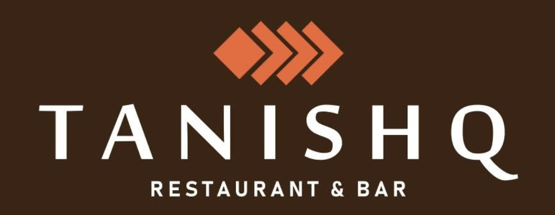 Logo for Tanishq Restaurant & Bar on a brown background, with three orange geometric arrows above the name “Tanishq Restaurant” in bold white text. This stylish design reflects the modern ambience of this popular dining spot in Toot Hill. Logo for Tanishq Restaurant & Bar on a brown background, with three orange geometric arrows above the name “Tanishq Restaurant” in bold white text. This stylish design reflects the modern ambience of this popular dining spot in Toot Hill.